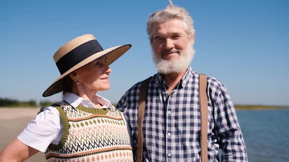 A Healthy Elderly Retired Couple Relax and Enjoy a Romantic Outdoor Adventure Together