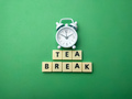 White alarm clock with the word TEA BREAK - PhotoDune Item for Sale
