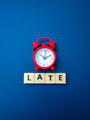 Red alarm clock with the word LATE - PhotoDune Item for Sale