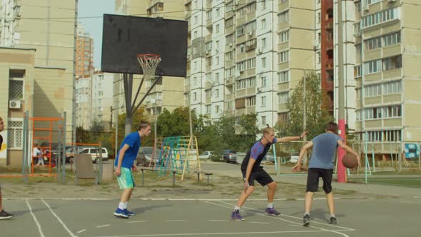 Offensive Streetball Team Scoring Field Goal on Court