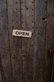 singboard Open on wooden textured door. - PhotoDune Item for Sale