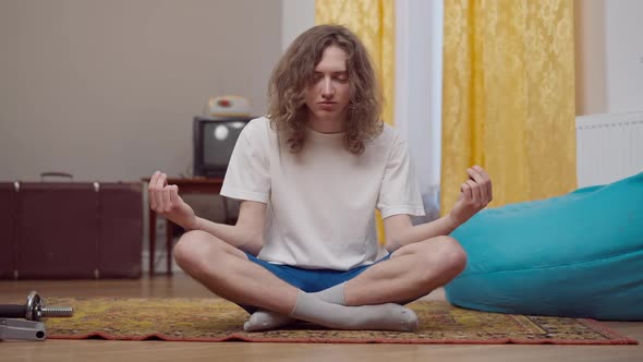 Relaxed Man in Yoga Lotus Pose Hearing Noise and Running Away