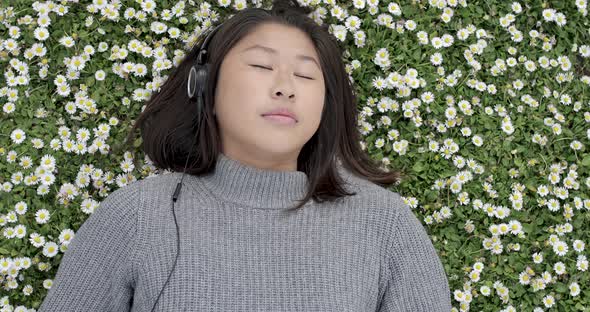 Authentic shot of a beautiful young woman relaxing at park in spring