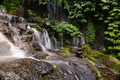 Long exposure shot of Banyumala waterfal with pile of stones - PhotoDune Item for Sale