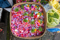A basket full of flower petals at the market in Bali to be used for offerings - PhotoDune Item for Sale