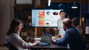 Business analytics team meeting, woman showing corporate presentation