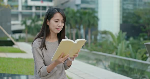 Woman read book at outdoor