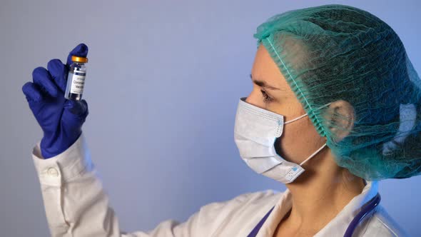 Female Doctor Holding Vial of Coronavirus Vaccine