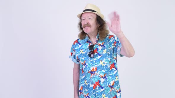 Happy Senior Tourist Man Waving Hand Ready for Vacation