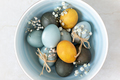 Colored Easter eggs in a bowl, top view - PhotoDune Item for Sale