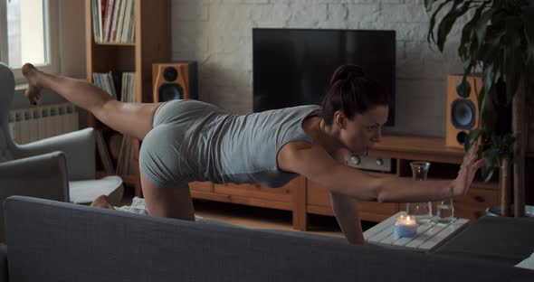 Young Woman Doing Sports and Yoga at Home