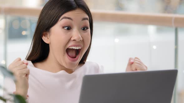 Close Up Happy Excited Asian Girl Winner with Laptop Celebrate Triumph Good News Betting with Online