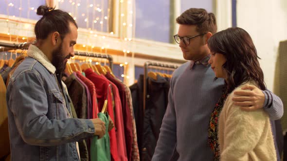 Friends Choosing Clothes at Vintage Clothing Store 16