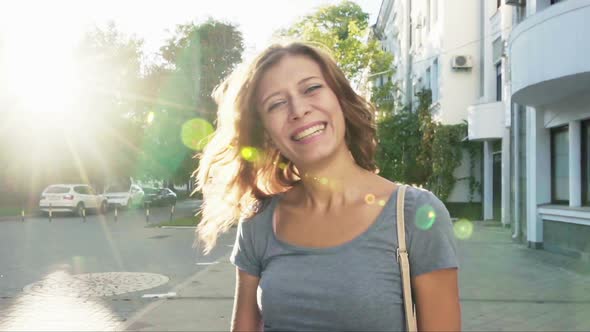 Caucasian Woman Smiling Face  With A Turn Of The Head And Hair