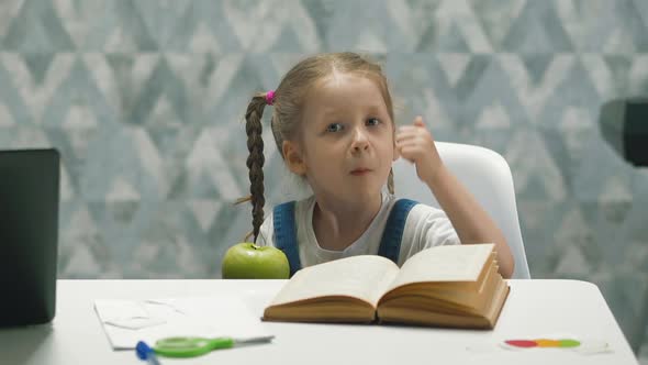 Portrait of Little Child During Home Schooling and