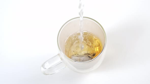 In a Large Glass Mug with Double Glass of Hot Water Brew Tea Bag