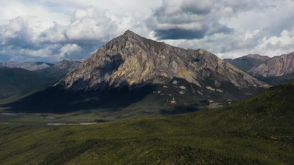 Aerial Drone Zoom in Towards Sukakpak Mountain in the Brooks Range in Alaska at summer