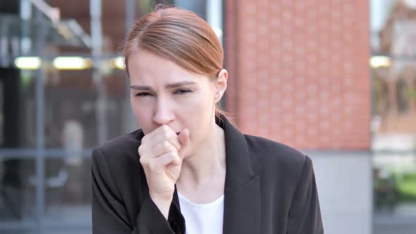 Sick Young Businesswoman Coughing Outdoor