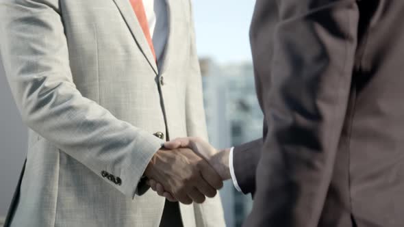 Partial View of Business People Shaking Hands Outdoor