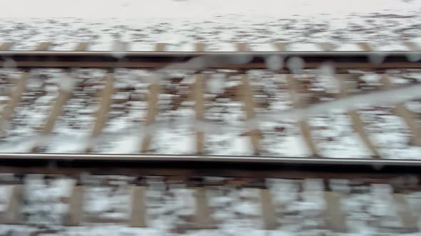 View of the Empty Snowcovered Railway From the Train Window on a Snowy Winter Day the Railways Cross