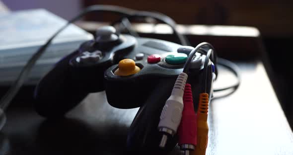 A video game controller with old school composite video cables during an esports professional gaming