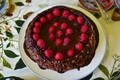 decadent photo of a freshly baked chocolate raspberry cake adorned with fresh red raspberries - PhotoDune Item for Sale