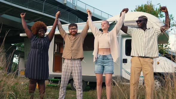 a Cheerful Group of Friends Holding Their Hands Up Summer Trip