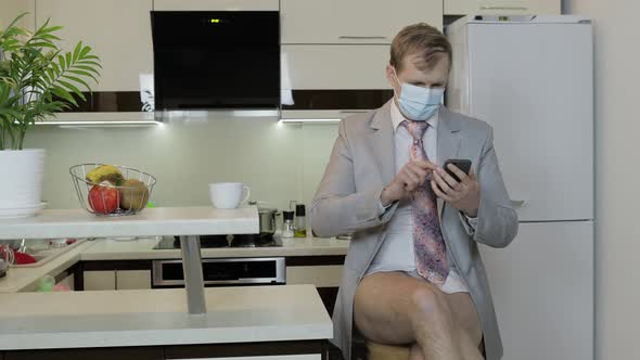 Quarantine. Businessman Working with Smartphone at Home Office. Coronavirus