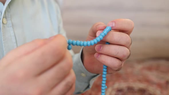 Muslim Pray with Rosary in Mosque