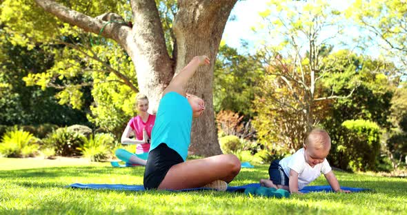 Woman exercising with her baby