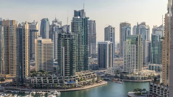 Beautiful Aerial View of Dubai Marina Promenade and Canal with Floating Yachts and Boats Before