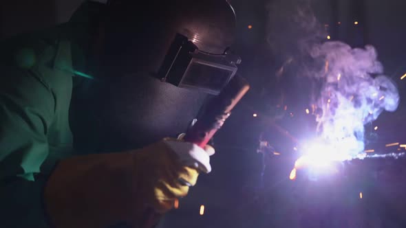 Metal Welder Working with Arc Welding Machine