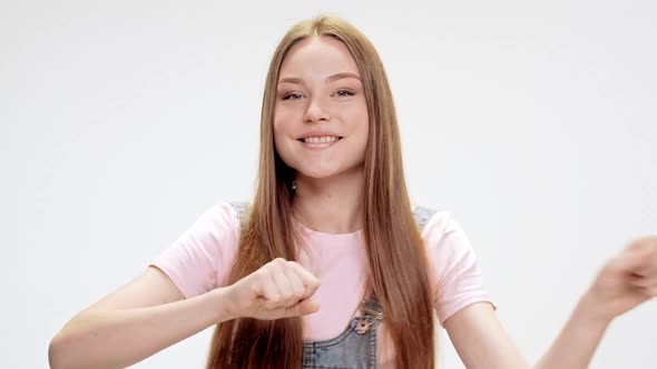 Young Beautiful Girl Dancing Smiling Singing Over White Background