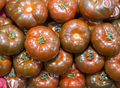 A pile of tomatoes on a table - PhotoDune Item for Sale