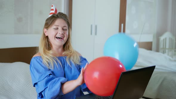 Quarantine Self-isolation, Young Happy Girl in Cap with Balloons and Pipe Congratulates Her Family