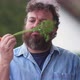 Bearded man is skeptical about fresh carrot and healthy diet - VideoHive Item for Sale