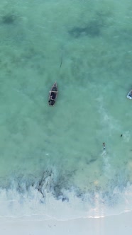 Boat Boats in the Ocean Near the Coast of Zanzibar Tanzania Slow Motion Vertical Video