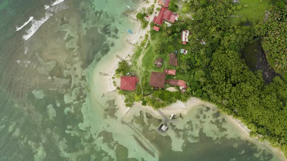 Aerial shot of some beach houses on beautiful beach, Bocas del Toro, Panama.