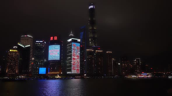 Puddle and skyscrapers at night, Shanghai - China largest city