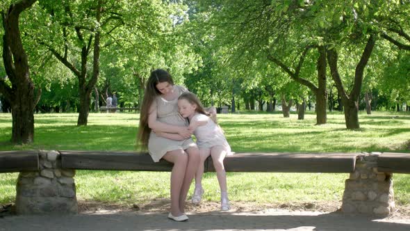 Pregnant Woman with little girl daughter