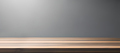 A wooden bench with a light on it and a gray wall behind it. - PhotoDune Item for Sale