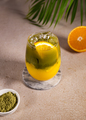 Cold matcha, passion fruit and orange alcohol cocktail with ice. Summer party or bar menu concept. - PhotoDune Item for Sale