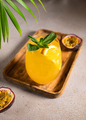Cold passion fruit cocktail with orange slice and ice. Summer party or bar menu concept. - PhotoDune Item for Sale