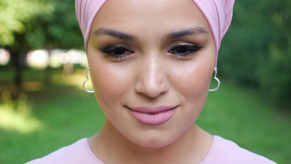 Closeup of a Beautiful Woman Wearing a Soft Pink Turban