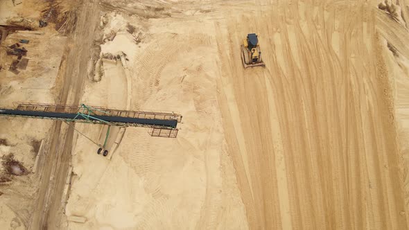 Sand Quarry in Working Process with Heavy Machinery