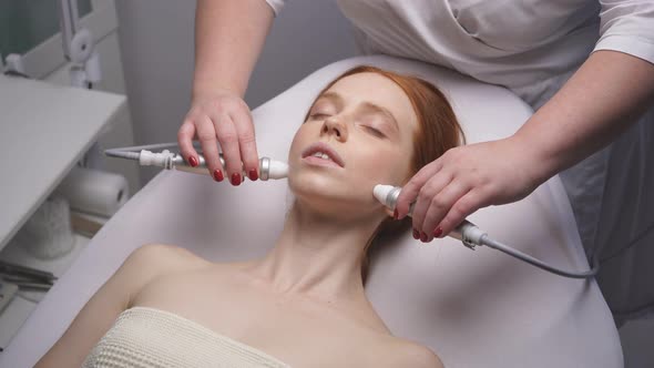 Young Woman in the Cosmetologist's Office Will Receive the Facial Skin Rejuvenation Procedure