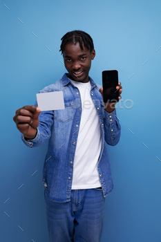 stylish american man with black dreadlocks holding money card mockup