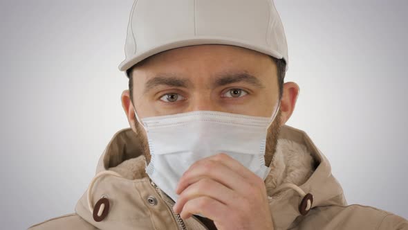 Coughing Casual Man in Medical Mask on Gradient Background