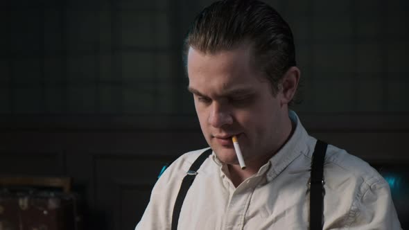 Close Up Look on Face of Real Detective in White Shirt and Suspenders with Cigarette in His Teeth