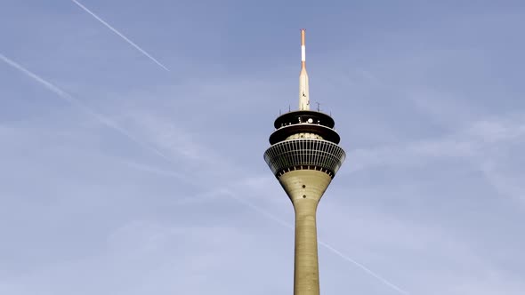 Düsseldorf, Germany - TV tower of Düsseldorf with plane crossing the sky above the city center of Dü